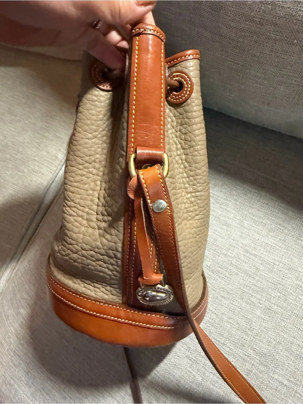 Dooney & Bourke Taupe Pebbled Leather Bucket Bag with Tan Trim